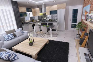Proprietate în Alanya: Zonă de living open-space cu bucătărie modernă, dulapuri din lemn deschis și canapea confortabilă gri, creând o atmosferă luminoasă.