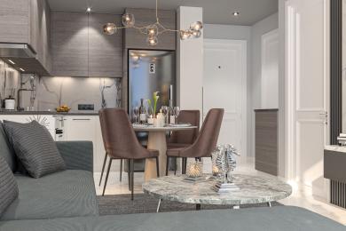 Alanya property featuring a modern living area with an open kitchen, marble accents, stylish lighting, and a comfortable, inviting atmosphere.