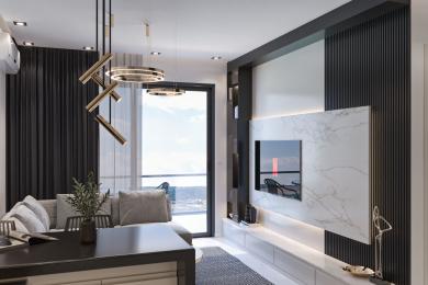 Alanya əmlakının qonaq otağı müasir işıqlandırma, mərmər TV divarı, tünd ağac vurğuları və eyvana çıxışı ilə dəbli bir atmosfer yaradır.