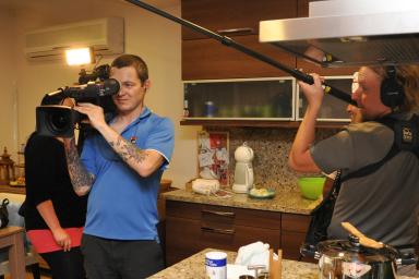 Filming inside a modern Alanya holiday home kitchen, showcasing comfortable living for tourists.